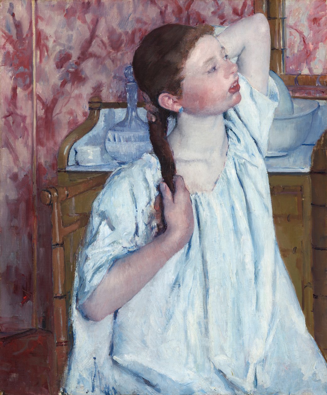 髪を整える少女（1886年 作： メアリー・カサット