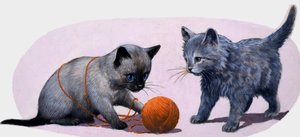 羊毛のボールで遊ぶ子猫