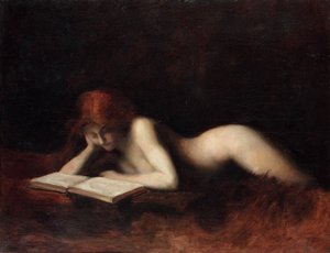 本を読んでリクライニングヌードの女性
